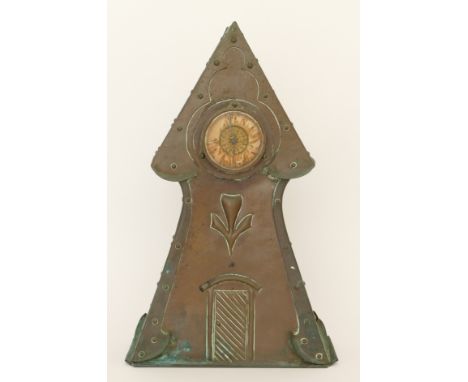 An Arts &amp; Crafts period hammered copper cased architectural tower mantle clock, raised on plinth base, 34cm high. 