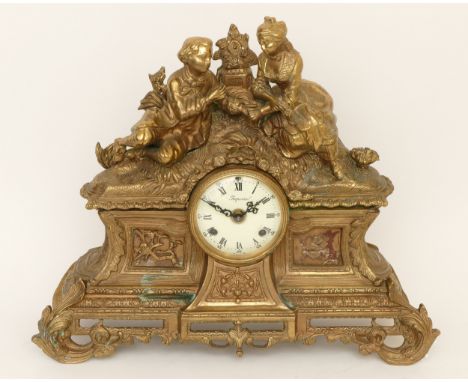 Imperial; a 20th century gilt brass cased mantle clock, the German movement striking on a bell, cast with courting couple, th