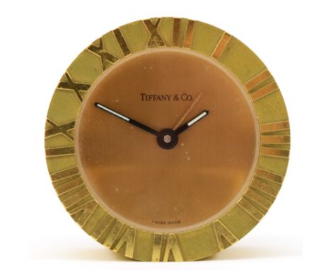Tiffany &amp; Co, a 20th century brass cased circular desk alarm clock, impressed number 205369 verso, 6.5cm diameter. 