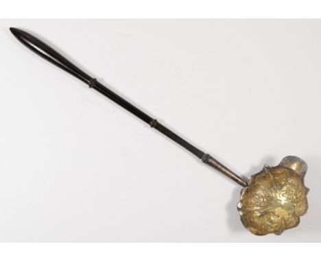 A George III silver punch ladle, marks poorly struck, the embossed bowl with lip, turned hardwood handle, 35cm 