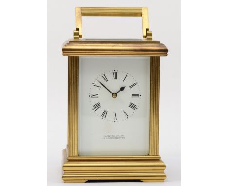 Garrard &amp; Co; a 20th century brass corniche cased hourly striking carriage clock, striking on a bell, with reeded fluted 