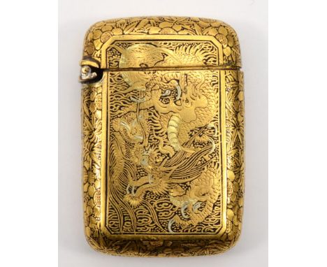 A Japanese Meiji period inlaid two tone vesta case, in the style of the Komai company of Kyoto, with chased dragon, crane and