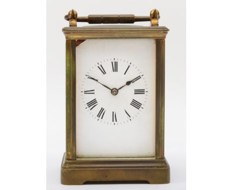 A 20th century French brass corniche cased half hour striking carriage clock, the white dial with black Roman numerals, strik