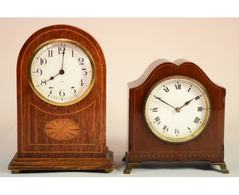 An Edwardian inlaid oak dome topped 8 day mantle clock, the white dial with black Arabic numerals raised on brass bun feet, 2