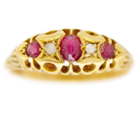An 18ct diamond and garnet set six-stone ring. Birmingham 1911, size R 1/2, 2.8g.