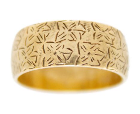 A 9ct modern hallmarked gold foliate engraved band ring. Size P 1/2, 5.7g.
