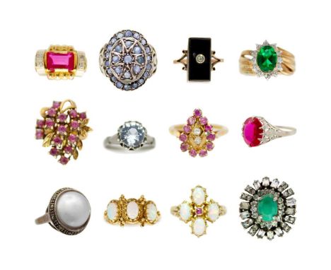 A collection of thirteen gem set rings. To inlcude two silver gilt white opal set rings, a white metal synthetic ruby set rin