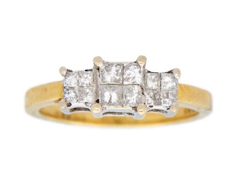 An 18ct diamond set ring. Set with three clusters of four princess cut diamonds totalling 0.50ct, Birmingham hallmark, size M