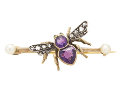 A SUFFRAGETTE BROOCH - In the form of a bee. High purity gold set with amethyst, diamonds and peridot eyes, the bar with end 