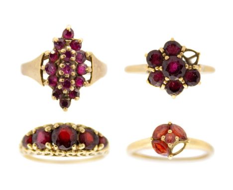 A selection of four 9ct garnet set dress rings. Size O-R, 11.3g.
