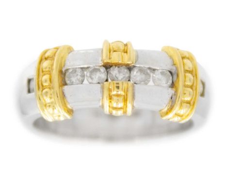 A modern 18ct white and yellow gold seven stone diamond ring. The round cut diamonds channel set and of 0.25ct total estimate