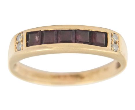 A 9ct ruby and diamond channel set ring. Stamped 9K, size M 1/2, 2.0g.