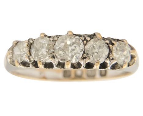 A Victorian 18ct white gold Old Mine Cut diamond five stone ring. The graduated diamonds of 1.20ct total weight approximately