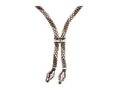 An unusual German Art Deco silver and white enamel double snake articulated necklace. Of tubular hollow form, the links with 