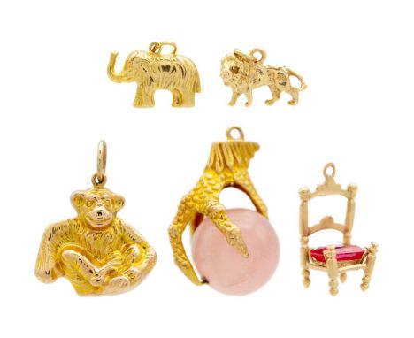 A selection of five 9ct charms. To include a monkey with hallmark, an elephant, a lion, a chair with synthetic ruby set seat 