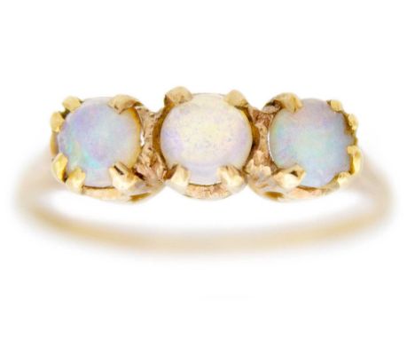 A 9ct opal set three stone ring. Hallmarked London 1960, size M 1/2, 1.8g.