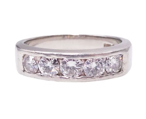 Platinum channel set five stone round brilliant cut diamond ring, Birmingham assay mark, total diamond weight approx 0.65 car