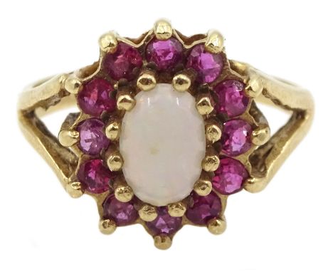 9ct gold oval opal and ruby cluster ringCondition Report:Approx 2.75gm, size J-K, tested 9ct (hallmarks rubbed)