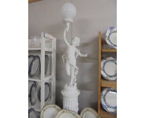 A floor standing cherub lamp. COLLECT ONLY.