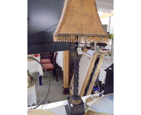 A tall good quality table lamp with beaded shade.