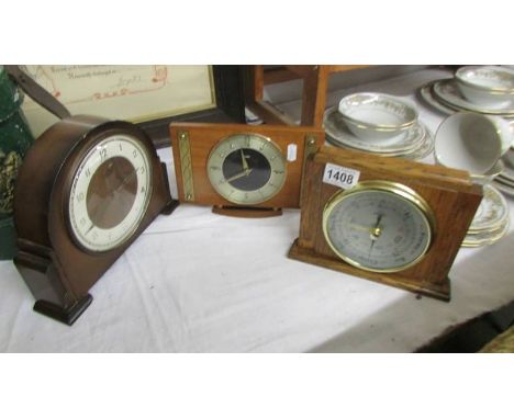 An oak cased barometer and two old mantel clocks.