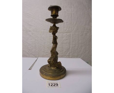 A Victorian brass sea serpent candlestick.