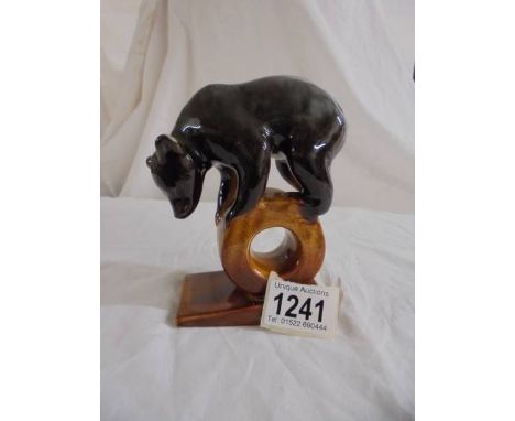 A Vintage brown bear on a log made in the USSR.&nbsp; Lonokovo "The Wheel" faience bear figurine stamped USSR and the Lonakov