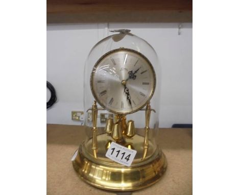 A Koma anniversary clock under dome.