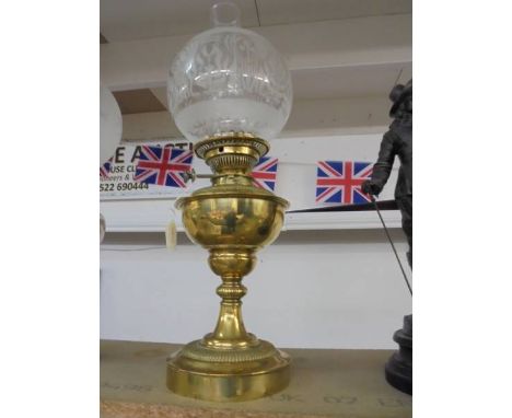 A Victorian brass oil lamp with etched glass shade, COLLECT ONLY.