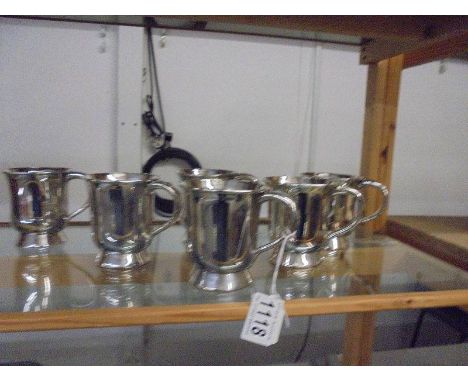 A set of six silver plate half pint tankards.