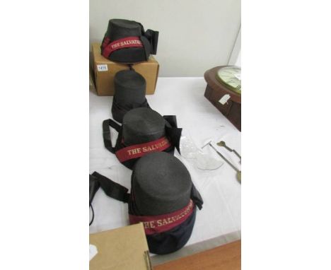 Four vintage Salvation Army bonnets (one missing banner).