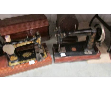 A vintage Singer sewing machine and one other. COLLECT ONLY.