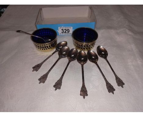 A pair of silver plate salts with blue glass liners &amp; 6 boy scout spoons