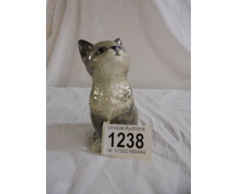 A vintage (1960's) Beswick small seated grey cat looking up Model number 1886.