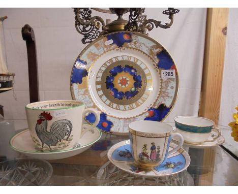A Royal Worcester Millenium plate, a large Adams tea cup with saucer and two other cups with saucers.