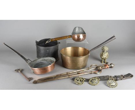 A quantity of metalware, including comical money box, various horse brasses, crane candlestick, miniature spirit level, large