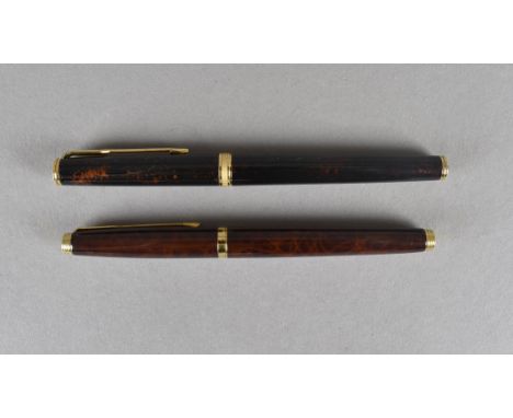 Two Parker fountain pens, both marked France, with enamel lacquered cap and bodies, 18 c gold and 14 ct gold nibs 