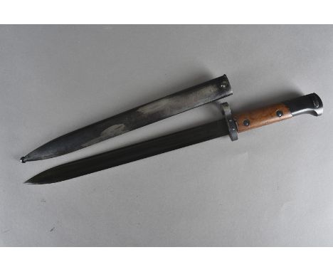 A late WWII period German dagger, unmarked to the dagger, marked E3 46 with lion to the clip of the scabbard, possibly unissu