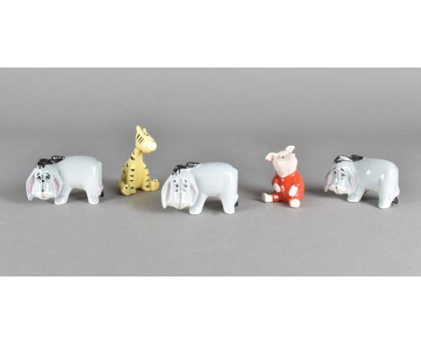 A collection of five Beswick Winnie the Pooh characters, including three Eeyore, one seated Piglet and Tigger 