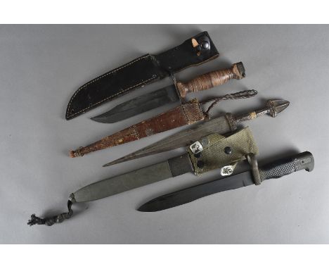 A Vietnam period US Conetta fighting knife, with scabbard, together with a Spanish M1964 CETME Model C bayonet and scabbard, 