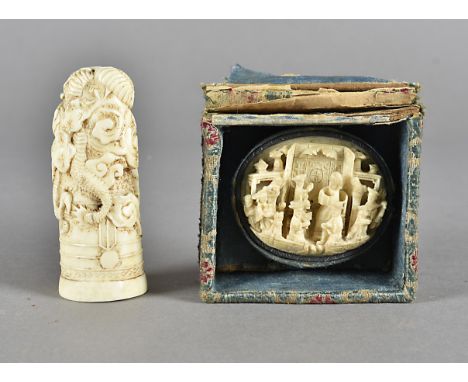 A 19th Century Chinese ivory carved cane handle, decorated with a dragon, 7.5 cm high   together with a 19th Century oval ivo