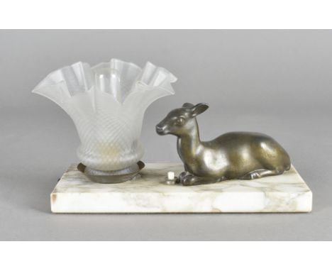 An art deco spelter and marble table lamp, the frosted, crimped shade surmounted by seated deer, 24 cm wide 