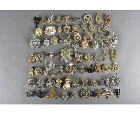 An assortment of 100+ modern military restrike cap badges, including Royal Pioneer Corps, Army Legal Corps, Royal Marines, 1s