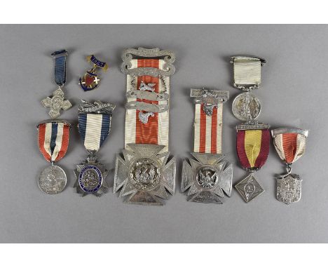 A collection of Masonic/Buffalo jewels, including three Army Temperance examples, two large silver examples from the Peace & 