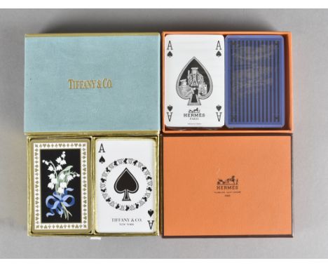 A Hermes cased set of playing cards, still in cellophane wrapping and a Tiffany set 