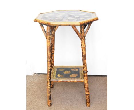 An Edwardian octagonal bamboo occasional table, with decoupage decoration of shells, stretcher shelf, 51 cm wide x 72 cm high