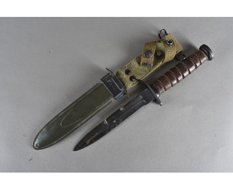 A US M3 fighting dagger, complete with a US M8A1 scabbard and frog 