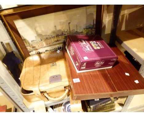 Shelf of mixed items including a cased dartboard