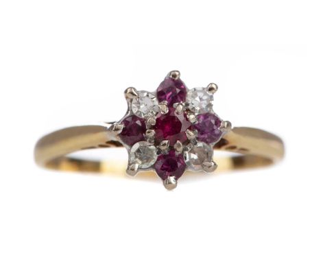 RUBY AND DIAMOND CLUSTER RING,set with alternating round rubies and diamonds, in eighteen carat gold, size L, 2.1g