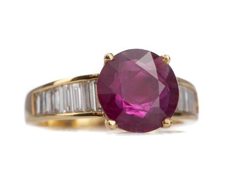 RUBY AND DIAMOND RING,set with a round ruby of approximately 3.26 carats, on baguette cut diamond shoulders totalling approxi